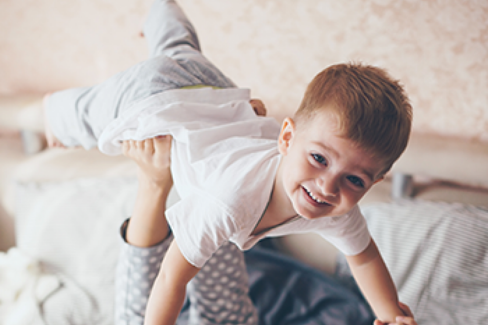 Mom and son playing airplane